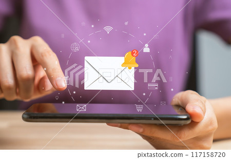 Woman hand using smartphone and shows a digital screen of new email notifications, messages to delivery. Woman hand using smartphone and shows a digital screen of new email notifications, messages to delivery. 117158720