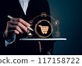 Businessman holding smartphone and showing shopping cart. 117158722