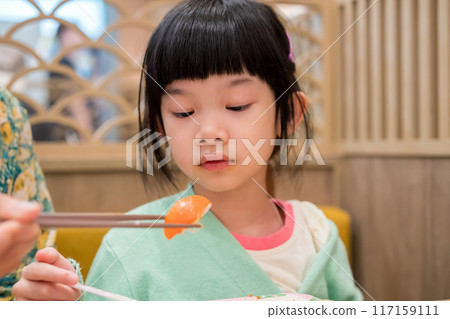 Cute little asian child girl eating food 117159111