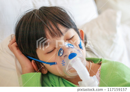 Sick little asian girl inhalation with nebulizer for respiratory treatment Sick little asian girl inhalation with nebulizer for respiratory treatment 117159157