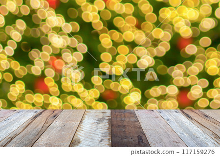 Empty wood table top with blur Christmas tree with bokeh light background Empty wood table top with blur Christmas tree with bokeh light background 117159276