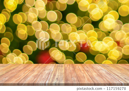 Empty wood table top with blur Christmas tree with bokeh light background Empty wood table top with blur Christmas tree with bokeh light background 117159278