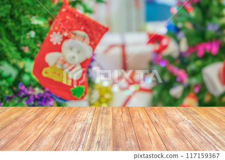 Empty wood table top with blur Christmas tree with bokeh light background 117159367