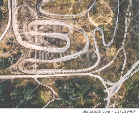 rolled tracks in countryside terrain, top view rolled tracks in countryside terrain, top view 117159464