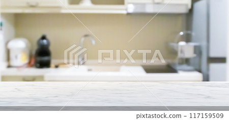 white marble stone counter top with blurred kitchen background 117159509