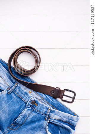 male jeans and belt on wooden background with text space 117159524