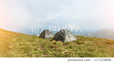 Tourist tents in camp in the mountain 117159666