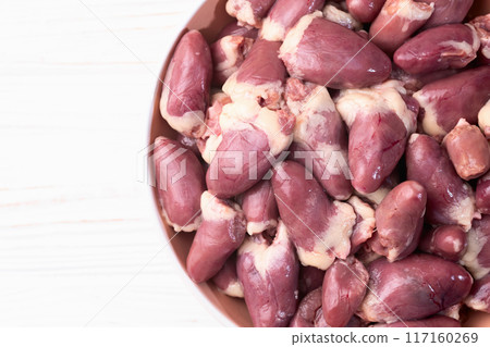 Raw chicken giblets hearts , meat background Raw chicken giblets hearts , meat background 117160269