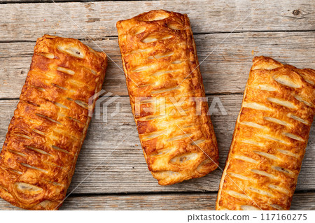 Golden Puff pastry stuffed with sausage and cheese 117160275