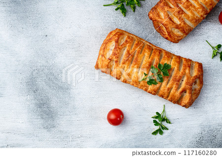 Golden Puff pastry stuffed with sausage and cheese 117160280