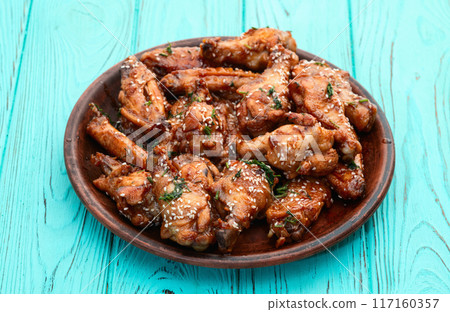 Caramelized in sause chicken wings  . Bar-b-q food background photo Caramelized in sause chicken wings  . Bar-b-q food background photo 117160357