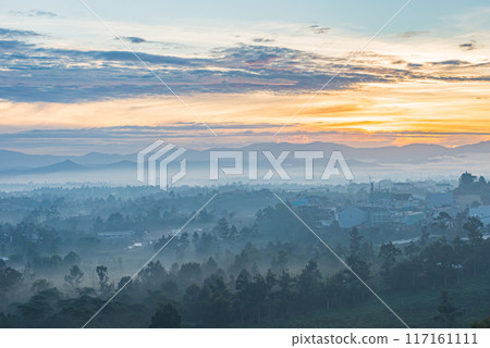 Beautiful misty forest mountain landscape at sunset Beautiful misty forest mountain landscape at sunset 117161111