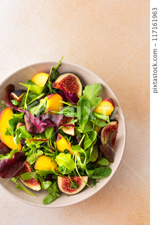 Salad with mixed lettuce,peaches and figs 117161963