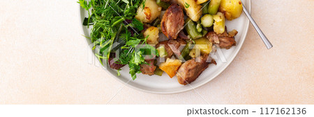 Stewed duck fillet with potatoes and asparagus and radishes, mixed salad of various greens, baked carrots in tahini sauce 117162136