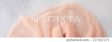 Home hobby, knitting a spider web sweater from pink threads Home hobby, knitting a spider web sweater from pink threads 117162173