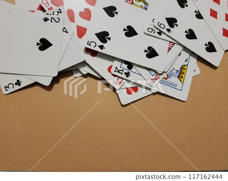 Randomly placed playing cards 117162444