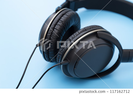 Headphones on a blue background Headphones on a blue background 117162712