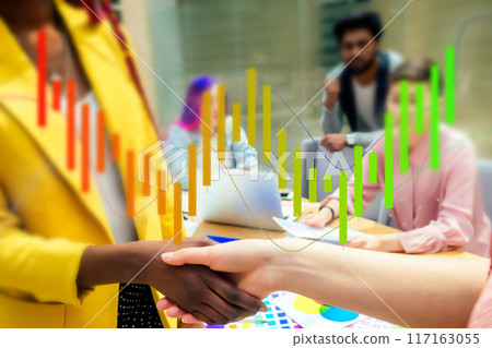 A woman is giving a presentation in front of a group of people 117163055