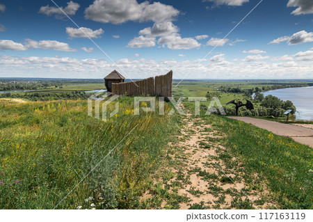 Ancient wooden fortress on a background of river spaces. Russia, Tatarstan, ancient Bulgar fortress in Yelabuga Ancient wooden fortress on a background of river spaces. Russia, Tatarstan, ancient Bulgar fortress in Yelabuga 117163119