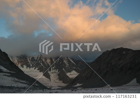 Tranquil Lake With Lush Green Forest, Snow-Capped Mountain, Blue Sky And White Clouds Tranquil Lake With Lush Green Forest, Snow-Capped Mountain, Blue Sky And White Clouds 117163231