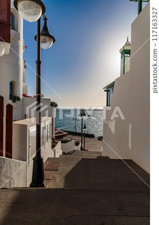 Early evening in the town of Puerto del Carmen on the island of Lanzarote, Canary Islands 117163327