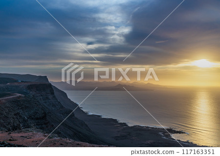Sunset over the landscape around Mirador del Rio on the island of Lanzarote, Canary Islands Sunset over the landscape around Mirador del Rio on the island of Lanzarote, Canary Islands 117163351