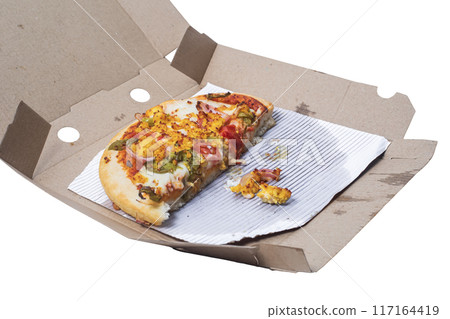 Leftover vegetarian paneer pizza beautifully decorated in a cardboard box on white background. Top view Leftover vegetarian paneer pizza beautifully decorated in a cardboard box on white background. Top view 117164419
