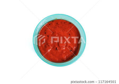Spicy chili chutney in the bowl on a white background. Spicy chili chutney in the bowl on a white background. 117164501