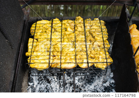 Grilled Chicken Marinated in Herbs Over Charcoal Fire Grilled Chicken Marinated in Herbs Over Charcoal Fire 117164798