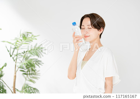 A woman drinking water 117165167