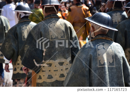 Takayama City, Gifu Prefecture, Japan: Spring Takayama Festival: People participating in the Daimyo Procession, wearing happi coats and jinbaori hats Takayama City, Gifu Prefecture, Japan: Spring Takayama Festival: People participating in the Daimyo Procession, wearing happi coats and jinbaori hats 117165723