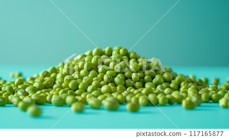 Featuring a few mung beans scattered from top to bottom on a clean light blue background. 117165877