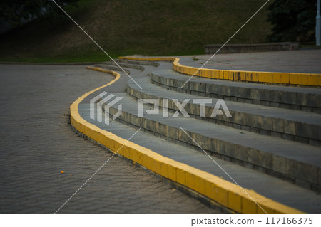 The steps in the park, the edges are painted yellow The steps in the park, the edges are painted yellow 117166375