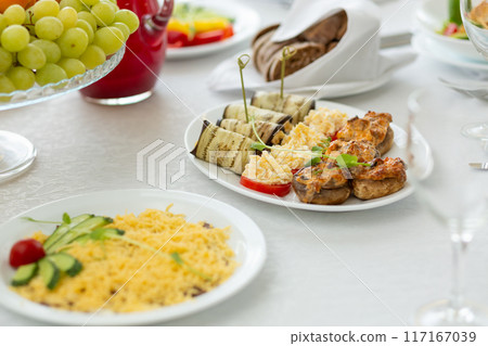 Wedding banquet in restaurant, covered round table for guests 117167039
