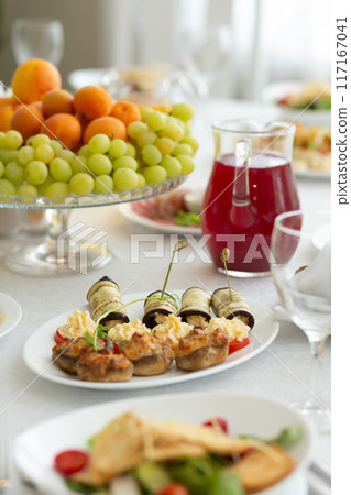 Wedding banquet in restaurant, covered round table for guests 117167041