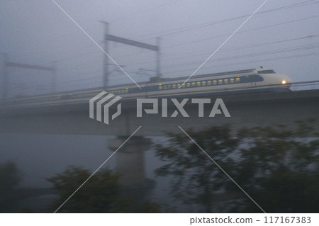 Sanyo Shinkansen 0 series Kodama train moving through the morning mist 117167383