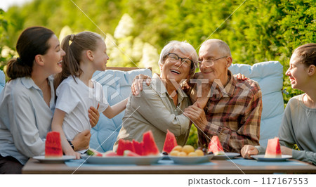 family spending time together in summer morning family spending time together in summer morning 117167553