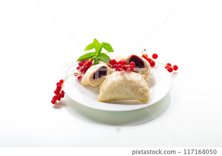 steamed sweet homemade dumplings with berries, red currants steamed sweet homemade dumplings with berries, red currants 117168050