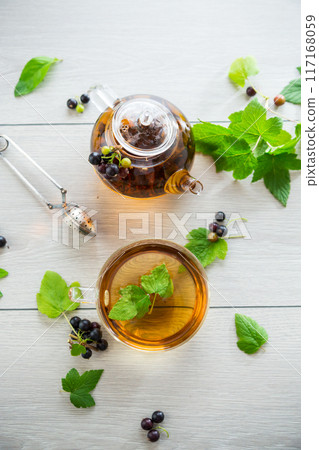 herbal tea from currant leaves and berries 117168059