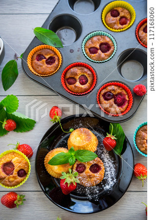 Sweet curd muffins with strawberry filling 117168060