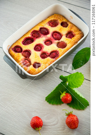 Sweet cottage cheese casserole with strawberry filling 117168061