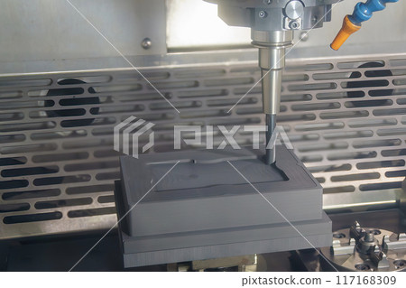 The CNC milling machine rough cutting the graphite electrode parts. 117168309