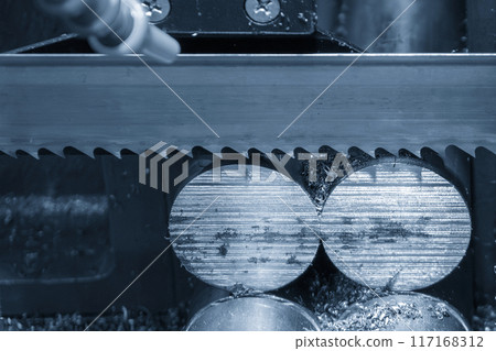 Close up scene the operation of circular blade saw cutting machine cutting the metal shaft parts. Close up scene the operation of circular blade saw cutting machine cutting the metal shaft parts. 117168312