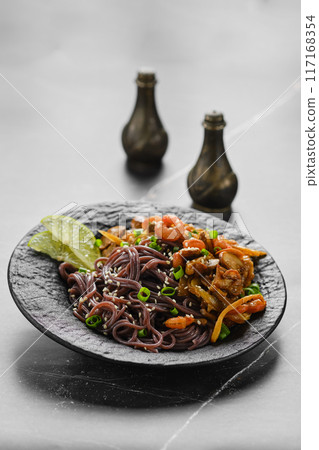 Black rice noodles with champignon and prawns 117168354