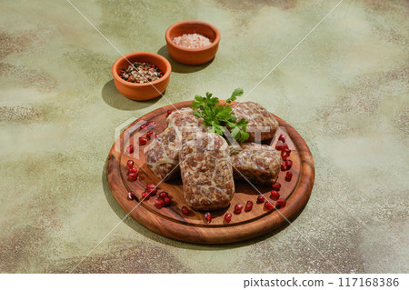 Georgian raw beef cutlets - Apkhazura, wrapped in fat net Georgian raw beef cutlets - Apkhazura, wrapped in fat net 117168386