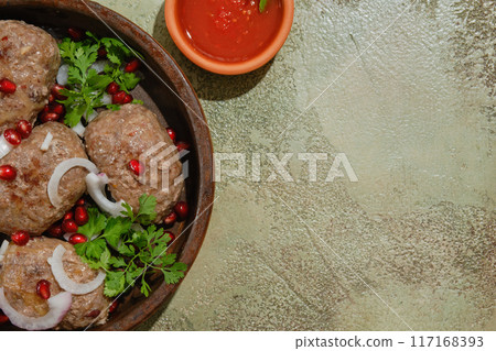 Georgian fried beef cutlets - Apkhazura in clay pot and adjika bowl 117168393
