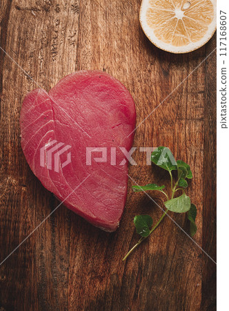 fresh red tuna fillet, for steak, raw, top view, on a cutting board, no people, fresh red tuna fillet, for steak, raw, top view, on a cutting board, no people, 117168607