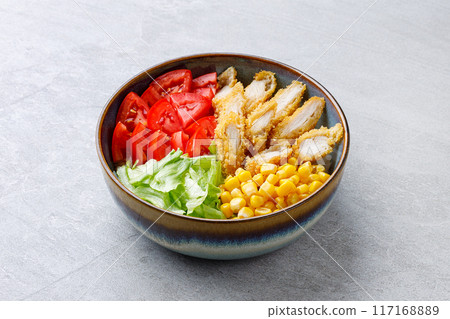 Crispy breaded chicken poke bowl on a gray background for a food delivery site 117168889