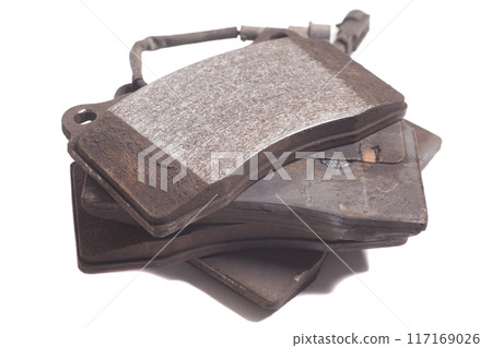 old auto brake pads isolated on white background 117169026