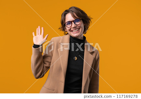 Friendly Student or BusinessWoman Waving Hand - Hello, Hi, Salute. Greetings. Friendly Student or BusinessWoman Waving Hand - Hello, Hi, Salute. Greetings. 117169278